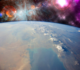 Wall Mural - close up planet earth biosphere in space with stars and galaxy on background. elements of this image