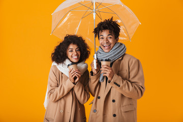 Sticker - Happy african couple wearing winter clothes