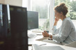 © LStockStudio - Businesswoman Working on a Desktop Computer