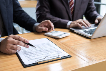 Co working conference, Business team meeting present, investor colleagues discussing new plan financial graph data on office table with laptop and calculator, Finance, accounting, investment