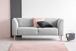 © Photographee.eu - Pastel pink and black design in elegant living room interior with comfortable sofa, real photo with copy space