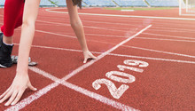 Athlete Starting Line On Running Track With 2019 Year