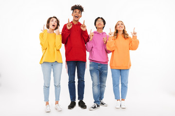 Wall Mural - Group of cheerful teenagers isolated
