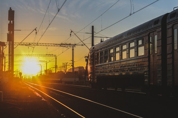 Wall Mural - railway at sunset public transport. transportation of people and freight.