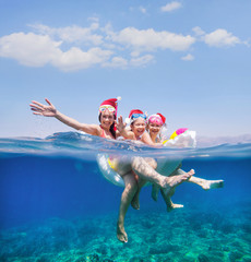 family swimming in the sea