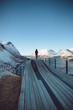 © Julia Nimke - Person looking at snow covered mountains and river