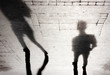Blurry shadow silhouettes of two people