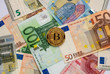 golden bitcoin coin on euro close up