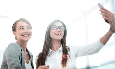 Sticker - business colleagues take selfies in a bright office