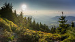 Sunset scenery on Smrk mountain in Moravskoslezske Beskydy in Czech republic with clear sky and only few clouds during late summer with Ondrejnik and Radhost