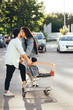 © teksomolika - Young, loving parents kiss in the parking near the supermarket.