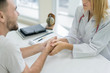 © Prasit Rodphan - Doctor or psychiatrist consulting and diagnostic examining stressful man patient in medical clinic or hospital healthcare service center.
