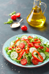 Sticker - Healthy vegetarian vegetable salad of fresh lettuce, cucumber, sweet pepper and tomatoes. Vegan plant-based food. Flat Lay. Top view