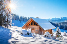 Winter Mountain Landscape With Wooden House On Sunny Clear Day