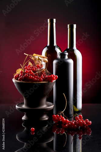 Fotomural Still life with berries of viburnum red and bottles