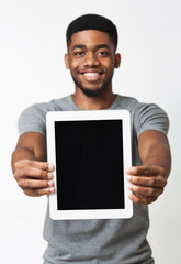 African-american man showing blank digital tablet screen