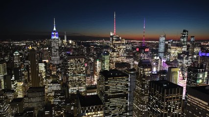 Poster - NEW YORK CITY - DECEMBER 2018: Fast Time Lapse of city skyline at night. The city attracts 50 million tourists annually