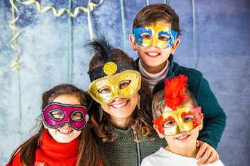 Portrait of a mother and her three children in Carnival