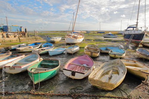 Cuadros en Lienzo Colorful boats at low tide, located along the Thames Estuary, Leigh on Sea, UK