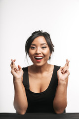 Poster - Pretty young asian woman sitting at the table