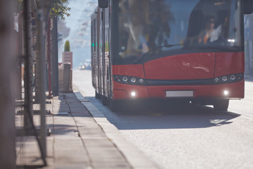 Public transportation / bus in urban surroundings on a station.