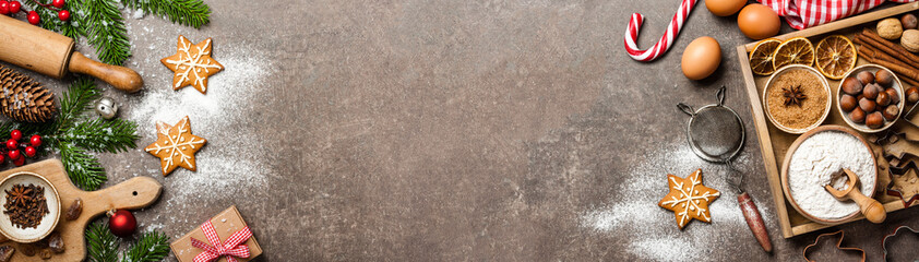 christmas background. table for holiday baking cookies with ingredients