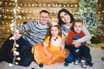 Poster - family sitting together in christmas house