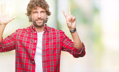 Handsome hispanic model man over isolated background showing and pointing up with fingers number seven while smiling confident and happy.