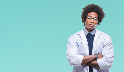 Sticker - Afro american doctor scientist man over isolated background skeptic and nervous, disapproving expression on face with crossed arms. Negative person.