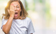 © Krakenimages.com - Middle age senior hispanic woman over isolated background covering one eye with hand with confident smile on face and surprise emotion.