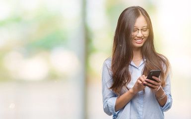 Sticker - Young asian woman texting using smartphone over isolated background with a happy face standing and smiling with a confident smile showing teeth