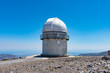 Mount Skinakas Peak astronomical observatory dome overlooking Heraklion city coastline, Crete, Greece. Sky astrophysical observatory at 2000m on Psiloritis mountain range. Astronomy concept.