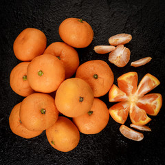 Wall Mural - Group of mandarins  on black background