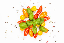 Centered Composition Of Basil, Pepper And Cherry Tomatoes, On White Background