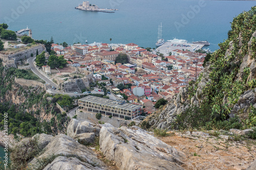 Fotografia old medieval city on sea shore line with small harbor aerial shot on south Europ