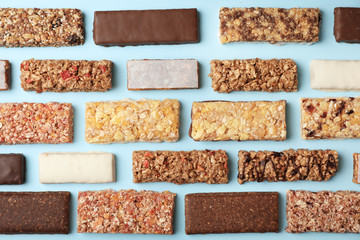 Wall Mural - Flat lay composition with protein bars on color background