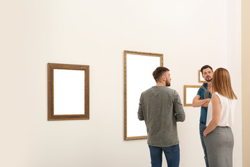 Wall Mural - People viewing exposition in modern art gallery