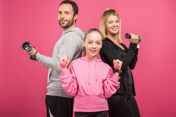 sportive family training with dumbbells, isolated on pink