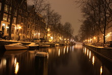 Amsterdam Covered In Snow At Night