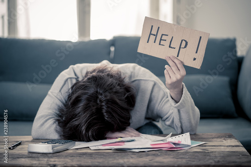 Fotomural Upset young woman asking for help in paying bills Mortgage home or business fina
