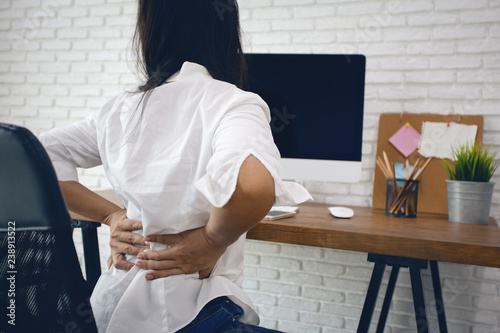Cuadros en Lienzo Business woman suffering from back pain in office home