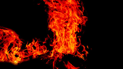 Fire flames on Abstract black background, Burning red hot sparks rise from large fire in, Fiery orange glowing