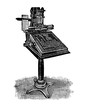 Vintage engraving of monotype keyboard printing machine comunicated with the caster machine by perforated tape from the text entered on the keyboard.
