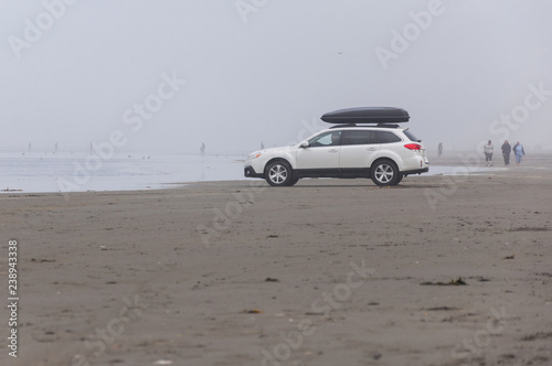 Fotografie, Obraz A white SUV in Pacific beach area, Ocean Shores, WA