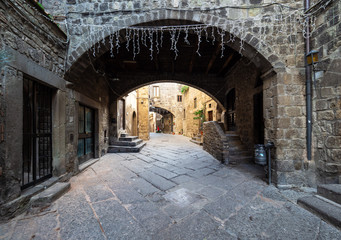 Wall Mural - Viterbo (Italy) - A sunday morning in the medieval city of the Lazio region, ancient district named San Pellegrino, during the Christmas holydays.