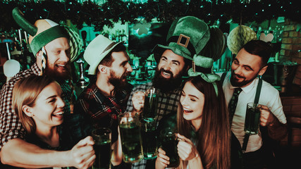 Young Company With Beer Glasses. St Patrick's Day.