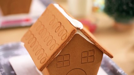 Canvas Print - Kids party to decorate small gingerbread houses  with candies.