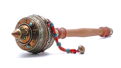 Tibetan hand prayer wheel. Isolated on white background