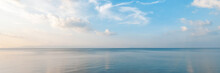 Bright Beautiful Seascape, Sandy Beach, Clouds Reflected In The Water, Natural Minimalistic Background And Texture, Panoramic View Banner
