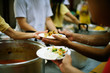 © kuarmungadd - Hand-feeding to the needy in society : concept of food sharing